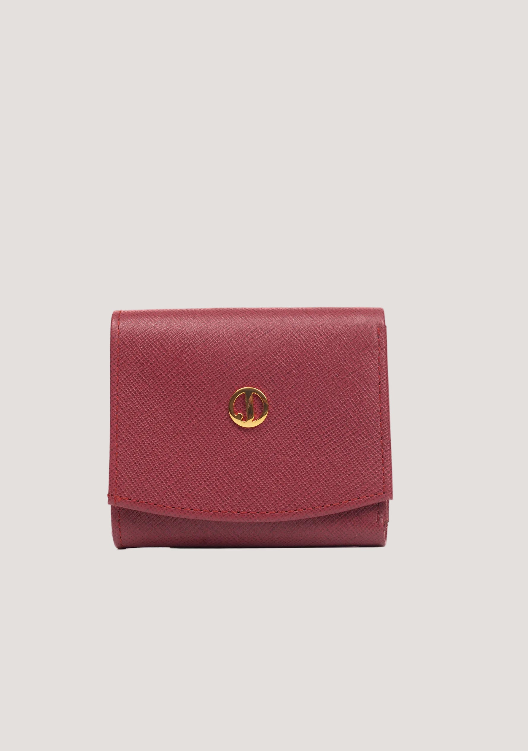 Pink wallet with a gold clasp on a white background